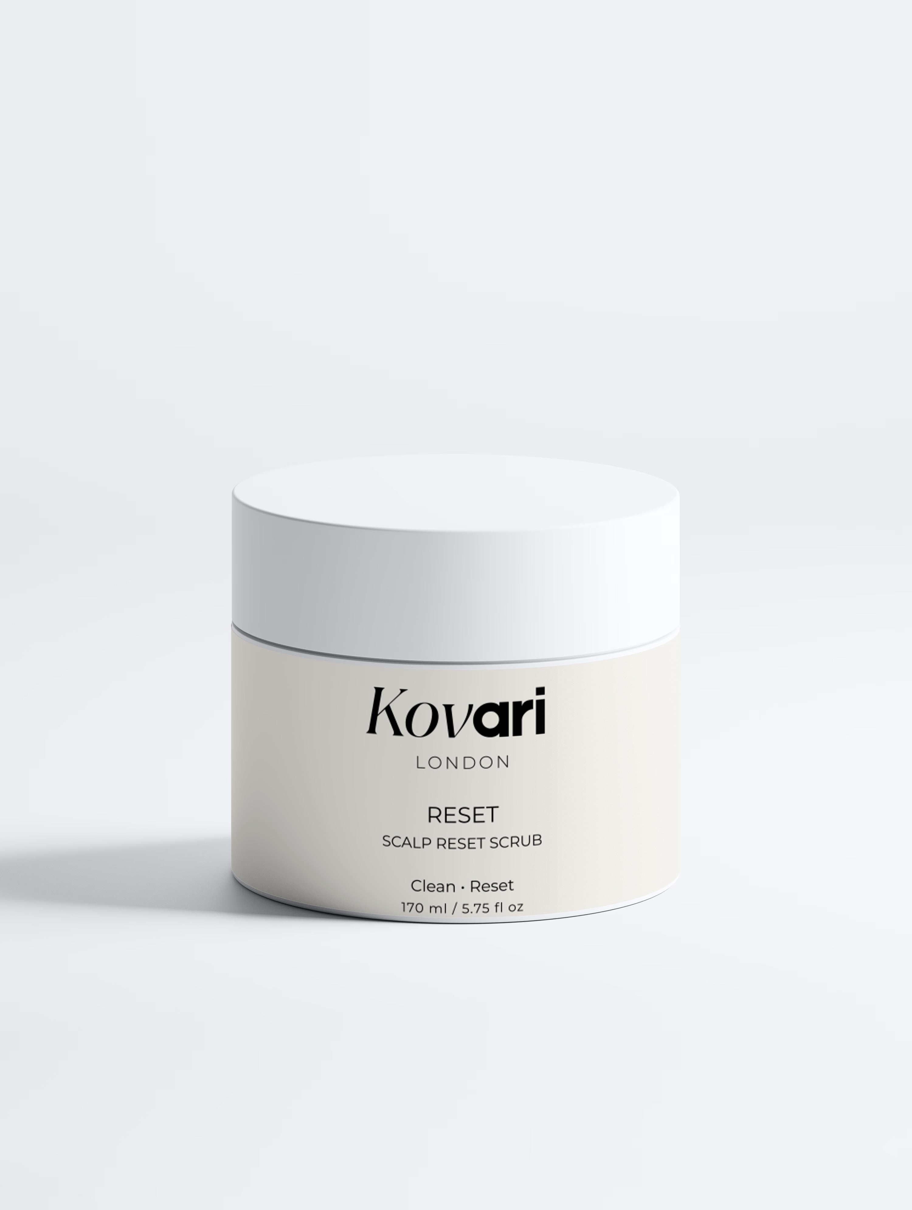 Kovari London Reset Scalp Reset Scrub in a clean, minimalist white jar with a matching white lid, set against a seamless light gray studio background.